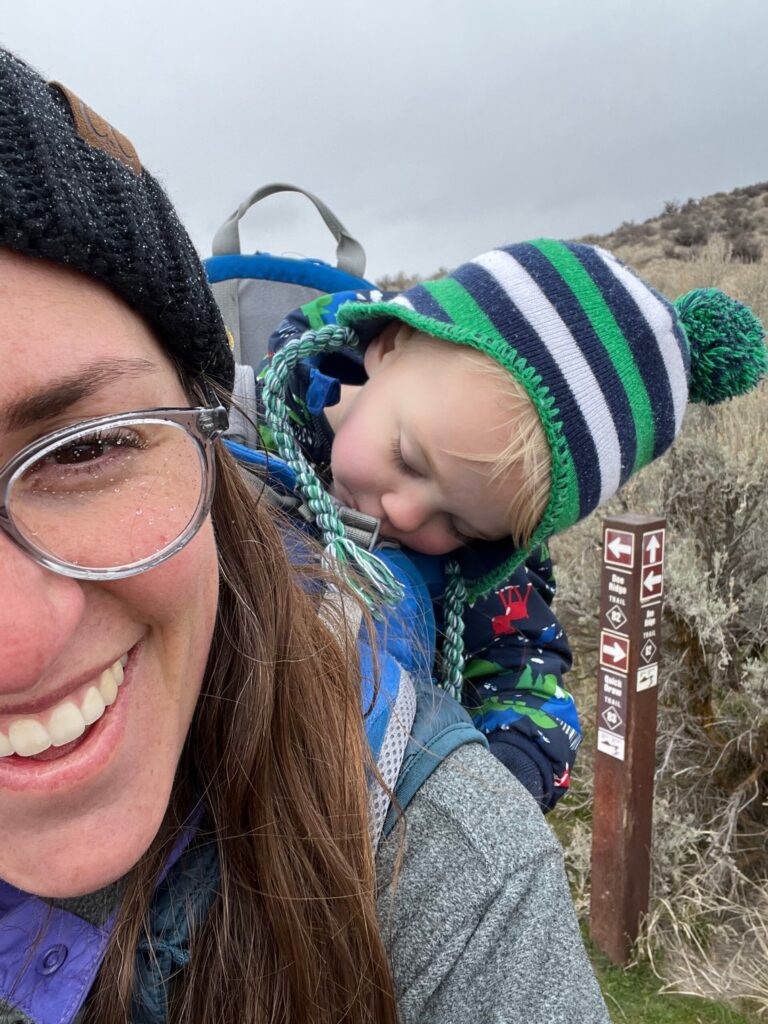 mom and baby in hiking carrier