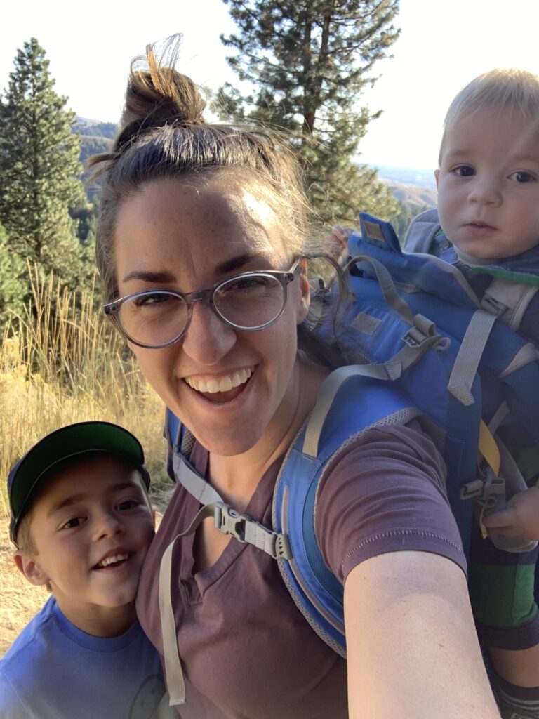 mom and two kids on a hike
