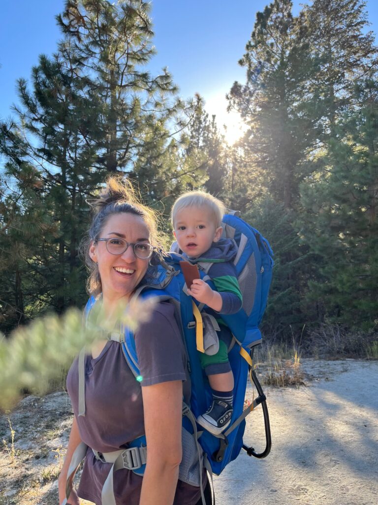 mom and baby in hiking carrier