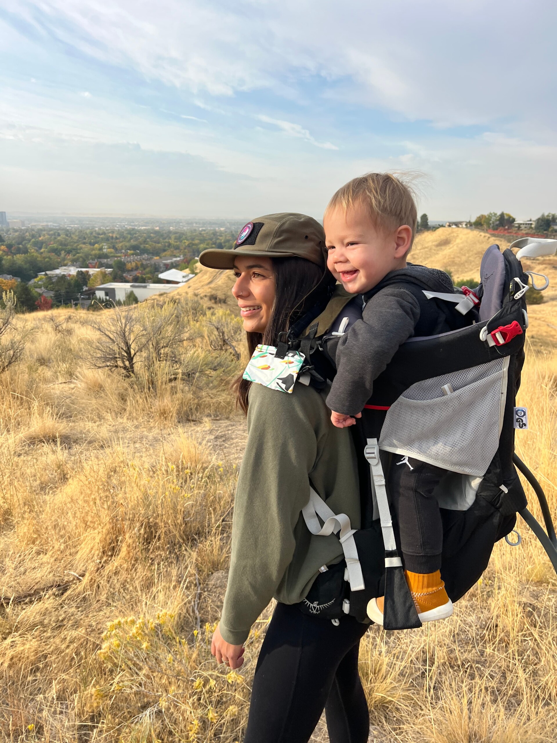 mom with baby in hiking backpack carrier