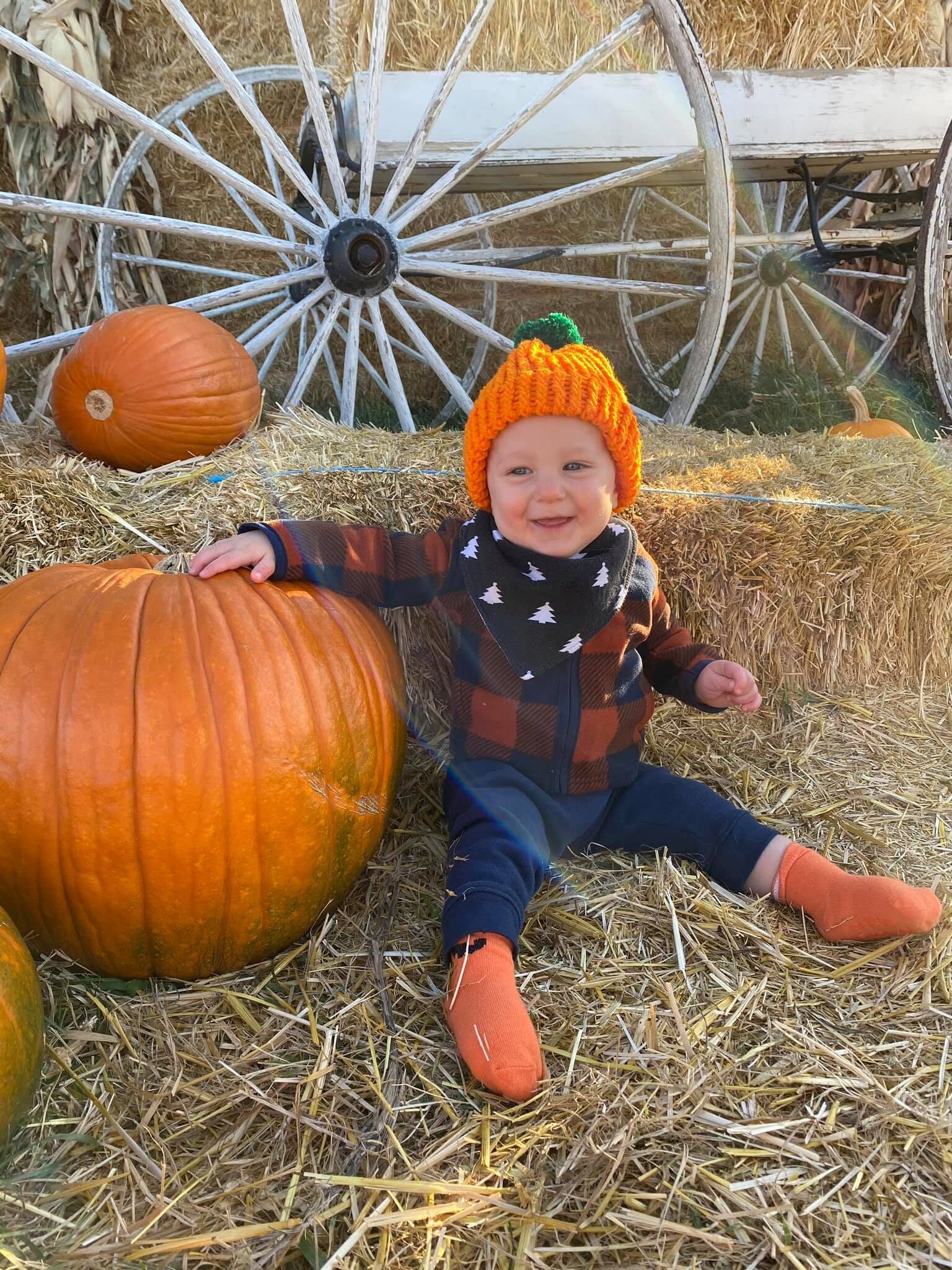 Baby with a pumpkin