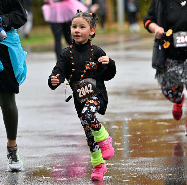 Child dressed up and running